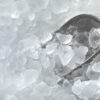 crushed ice with a scoop inside a commercial ice maker